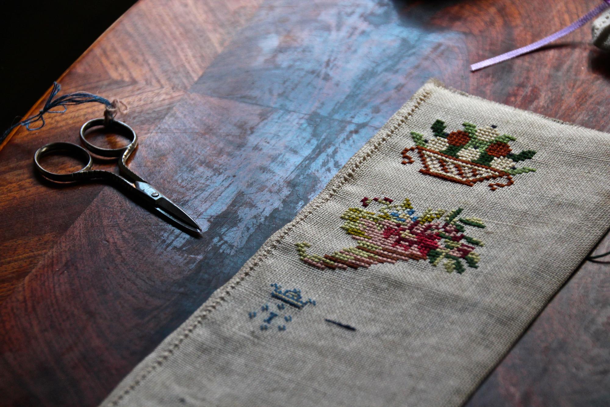 large editorial shot of embroidered table runner with cut-corner treatment